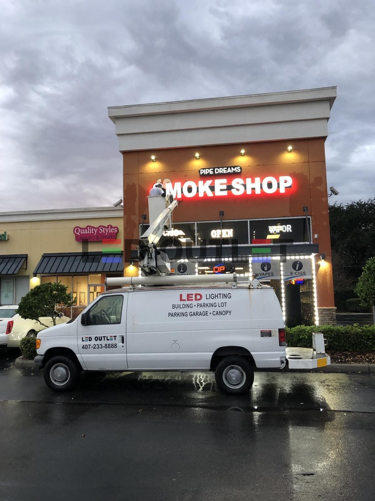 LED OUTLET bucket truck repairing channel letters on a smoke shop sign, Orlando FL